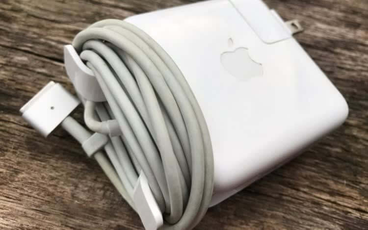 Cable management wings on a laptop charger