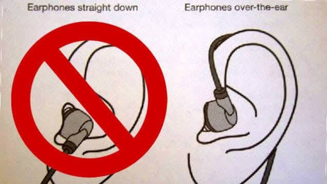 Wearing earbuds with the cable over the ear